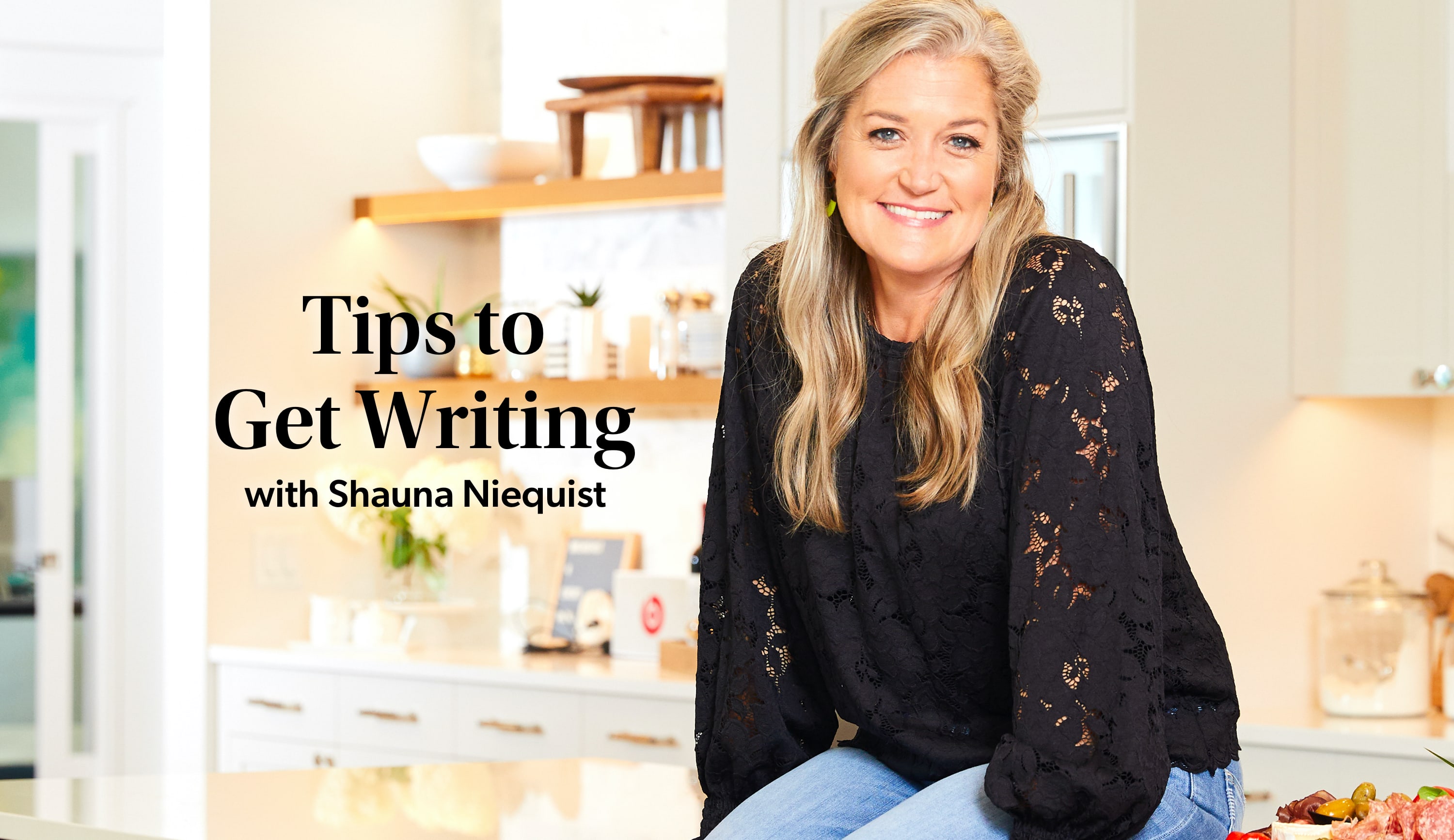 woman sitting on a kitchen counter smiling