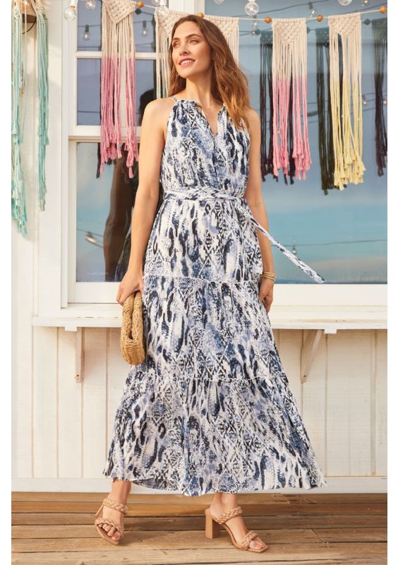 woman standing on porch.
